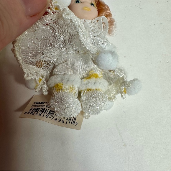 NWT. 7 porcelain doll ornaments. 5 of little girl and 2 of baby. - Picture 9 of 14